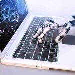 robot s hand typing on keyboard