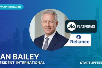 Professional headshot of Dan Bailey, the newly appointed President of International Business at Jio Platforms, featuring the Jio and Reliance logos on a blue StartupFeed branding background.